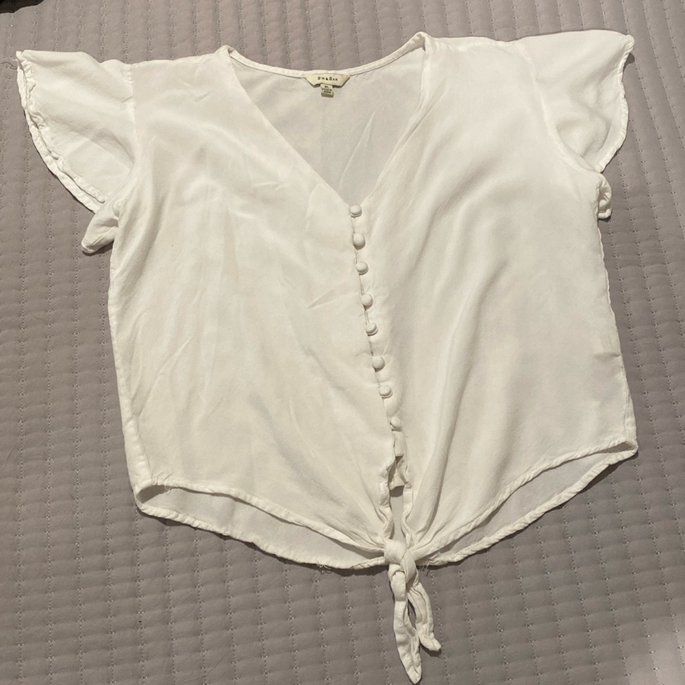 Tie-front blouse with button detail and flutter sleeve